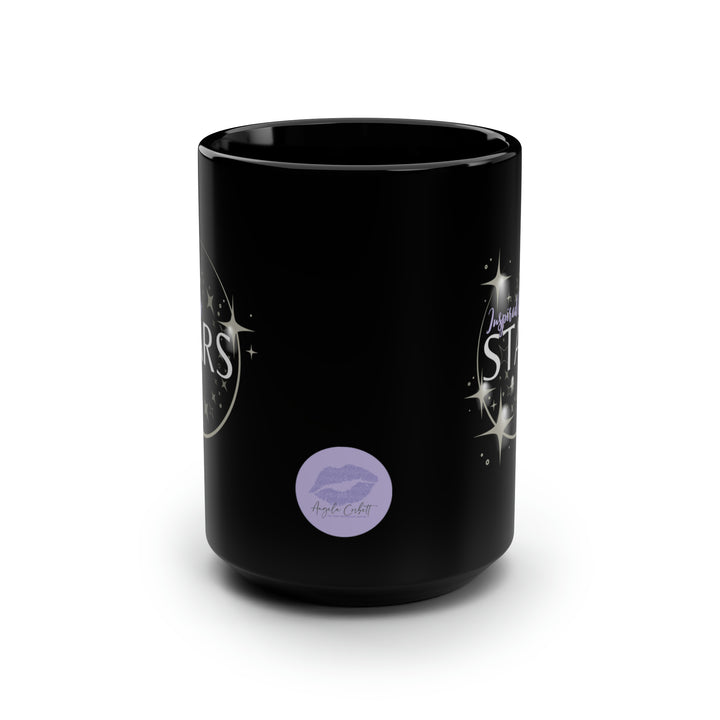 A black ceramic mug with a glossy finish, featuring a design with stars and the text &