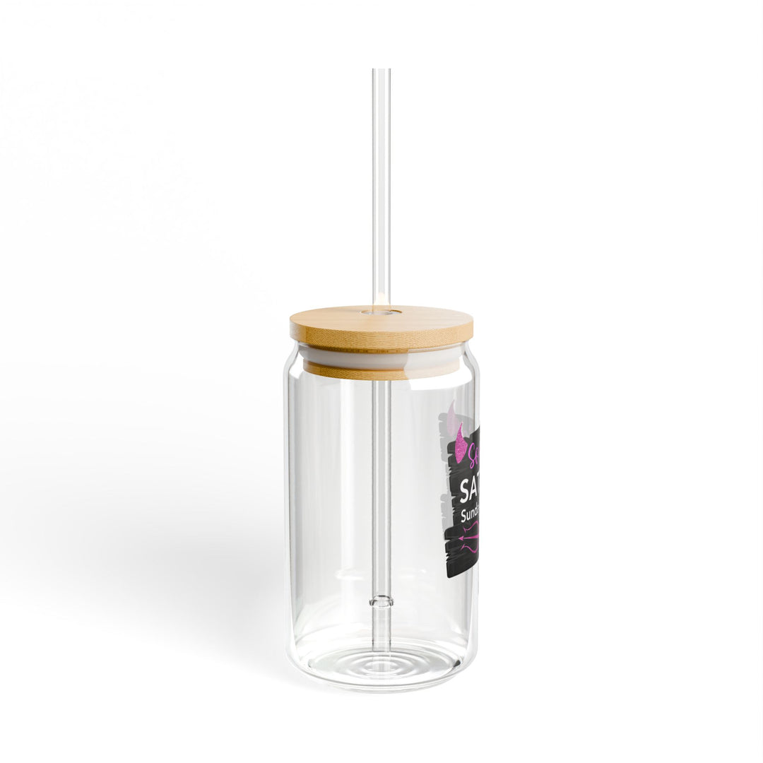 A clear tempered glass with a straw and a printed text &