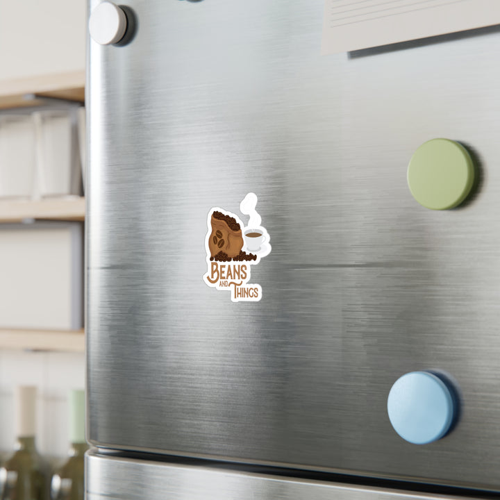 A sticker with an illustration of a cup of coffee and the text &