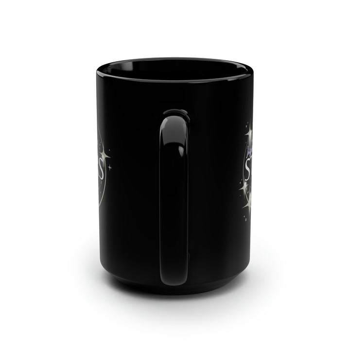 A black ceramic mug with a glossy finish, featuring a design with stars and the text &