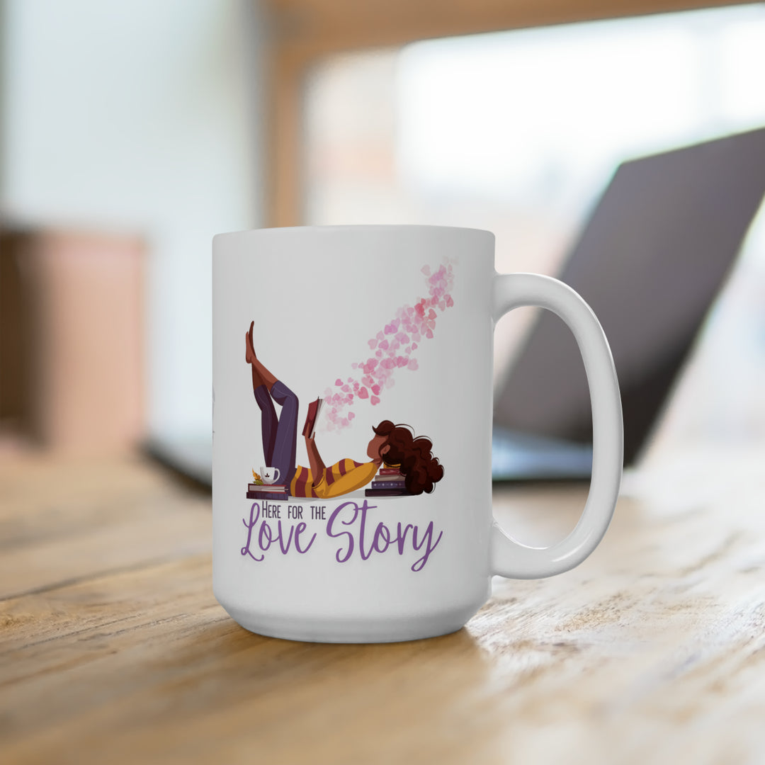 A white ceramic mug with a printed design featuring a character surrounded by pink and purple heart accents, and the text &