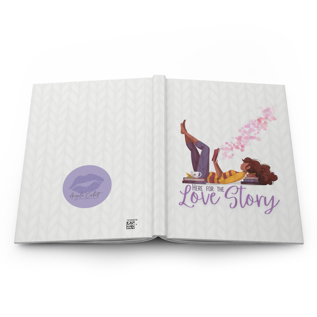 A hardcover journal with a white cover featuring a cartoon illustration of a woman reading a book, with the title &