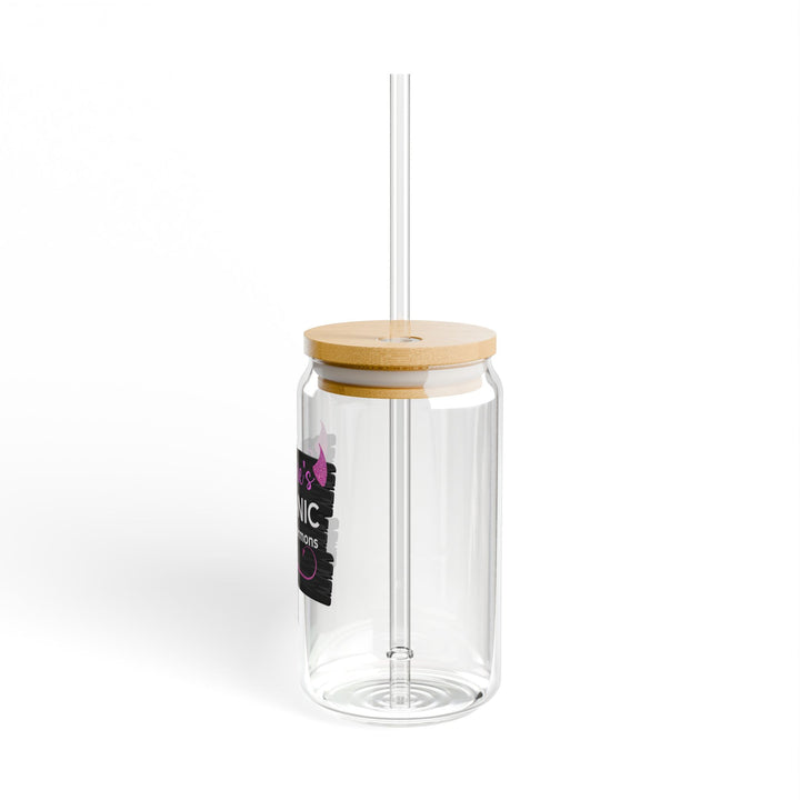 A clear tempered glass with a straw and a printed text &
