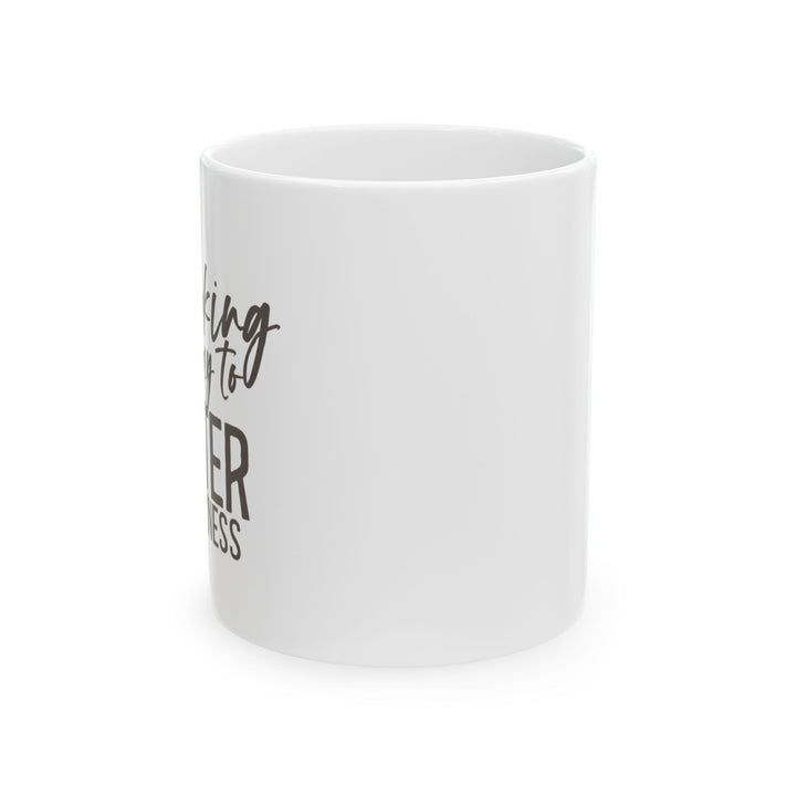 A white ceramic mug with the phrase &