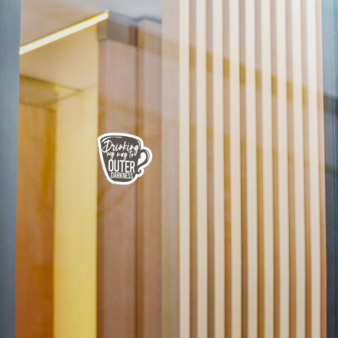 A sticker with a design that includes the text &