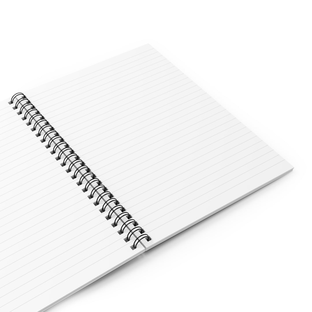 A spiral notebook with a dark grey back cover and a front cover print featuring a stylized design with the text &