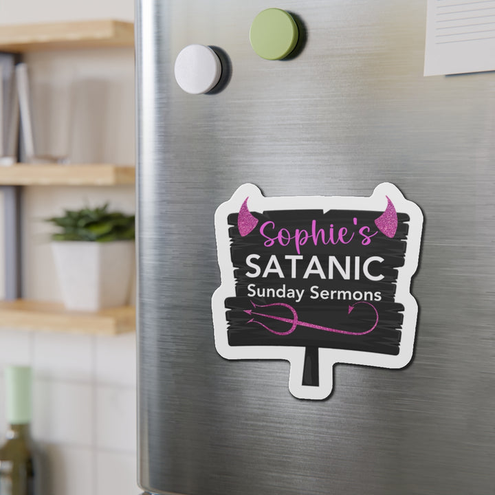 A custom die-cut magnet with vinyl material, featuring text &