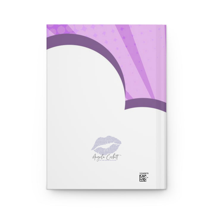 A journal with a purple and white cover featuring a silhouette of a woman superhero and the text &