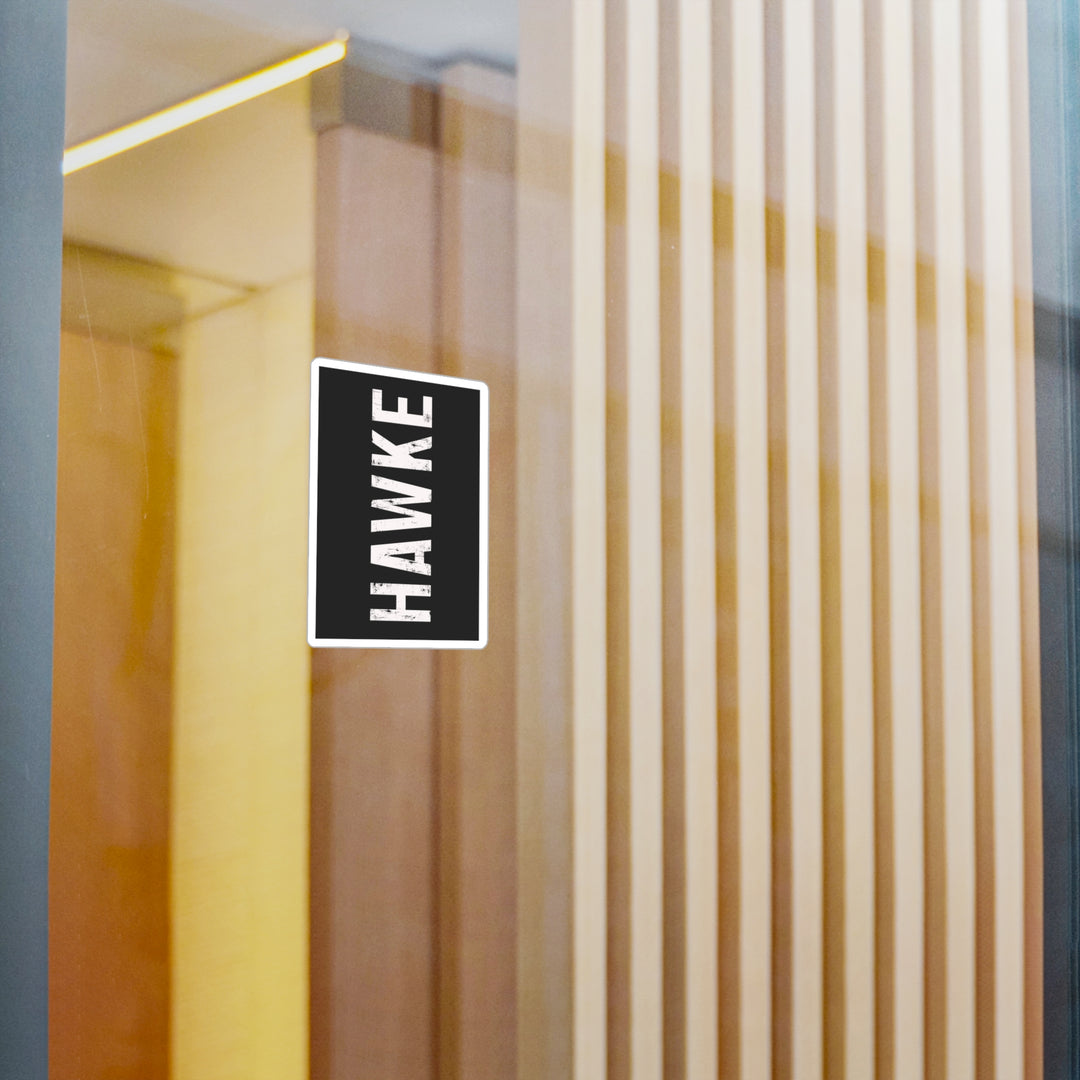 Hawke logo on a glass door with vertical blinds