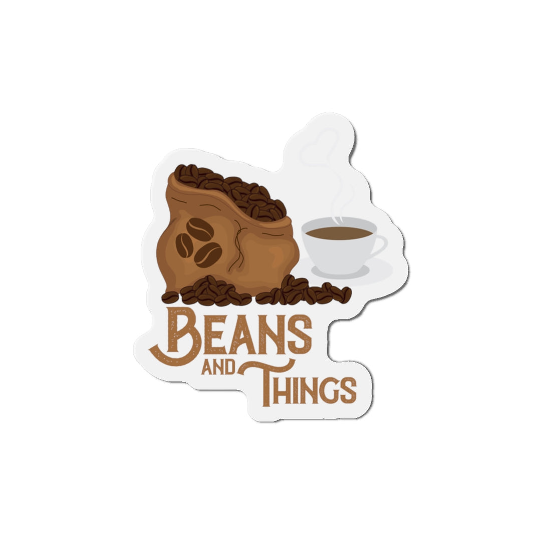 A magnet with an illustration of a coffee cup and beans, with the text &