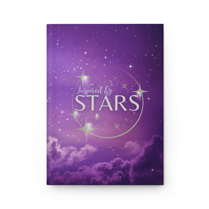 Hardcover journal with a space-themed cover, open to show blank lined pages, with the title &