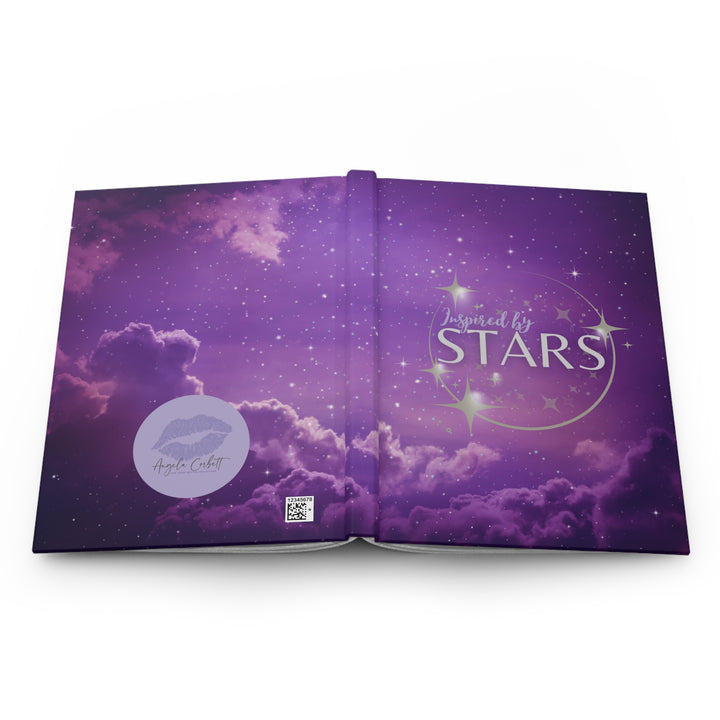 Hardcover journal with a space-themed cover, open to show blank lined pages, with the title &