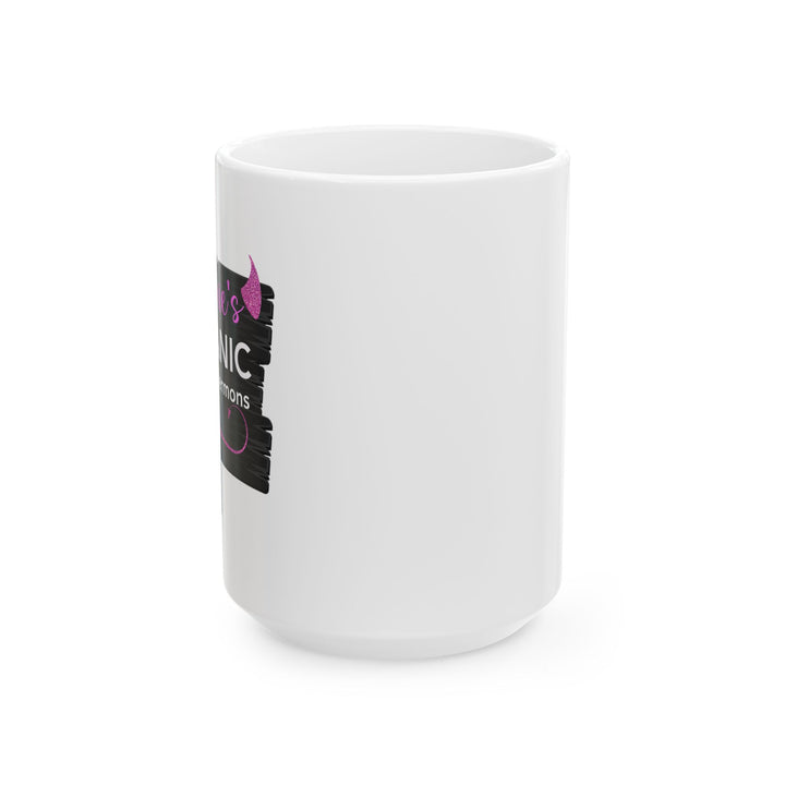 A white ceramic mug with black and pink text and graphics, featuring a playful sermon sign design.