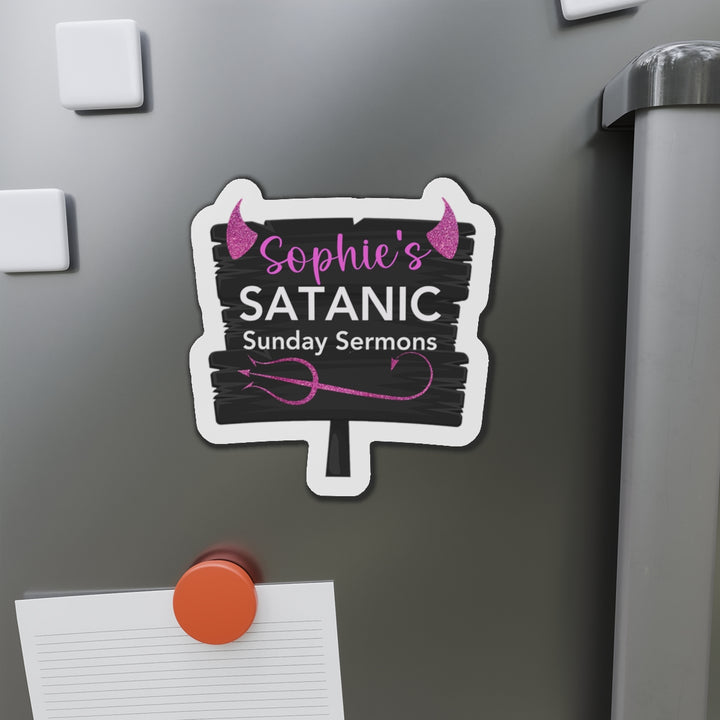 A custom die-cut magnet with vinyl material, featuring text &